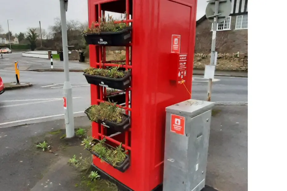 Red phone box located on Norman Road nr junction with A4 Bath Rd
