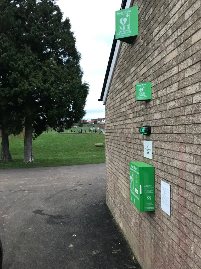 Defibrillator on the side of the Munday Playing Field's Building