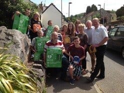 Group of people posing with External Defibrillator Cabinet