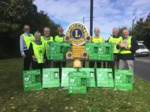 Group of men in high vis vests with External Defibrillators