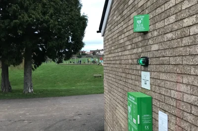 Defibrillator on the side of the Munday Playing Field’s Building Defibrillator on the side of the Munday Playing Field's Building